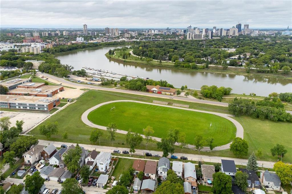 aerial view of a running track and the red river along Churchill Drive in Riverview