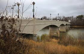 assiniboine park footbridge spanning the Assiniboine River during the fall 