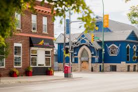 large character buildings including the west end cultural centre lining Ellice Avenue