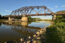 a railway bridge spanning the Assiniboine River in Headingley Manitoba